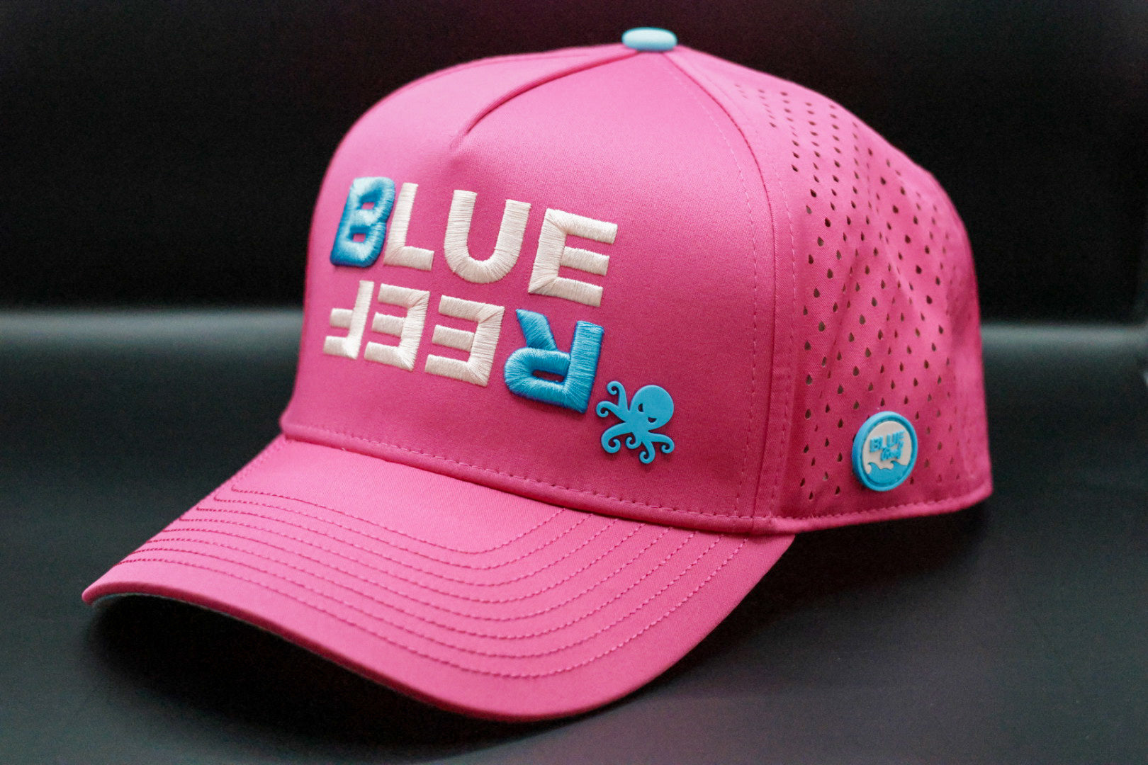 Gorra premium color fucsia con diseño tropical y detalles en azul – Blue Reef PR

Gorra impermeable rosada con logo bordado Blue Reef y ventilación lateral – Puerto Rico

Gorra rosada resistente al agua con logo de pulpo en goma – estilo urbano en Puerto Rico

Urban pink snapback with water-resistant design and Caribbean vibe – Puerto Rico style

Gorra impermeable, diseño unico, boricua, premium, puerto rico, dorado, guaynabo, unisex,, resistente al agua, snapback, alta calidad,estilo boricua, bordado.




