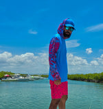 Rashguard azul con hoodie y mangas de diseño tropical fucsia – ropa de playa en Puerto Rico
Camiseta de protección solar con capucha y diseño de hojas caribeñas – estilo Blue Reef
Rashguard con hoodie para hombre, ideal para navegación y días soleados en el Caribe
Camiseta deportiva UV con capucha y mangas coloridas – moda acuática en Puerto Rico

Rashguard con hoodie, modelos exlusivos,puerto rico, protevvion solar
Ropa funcional de playa con diseño exclusivo Blue Reef – rashguard con estampado tropical"